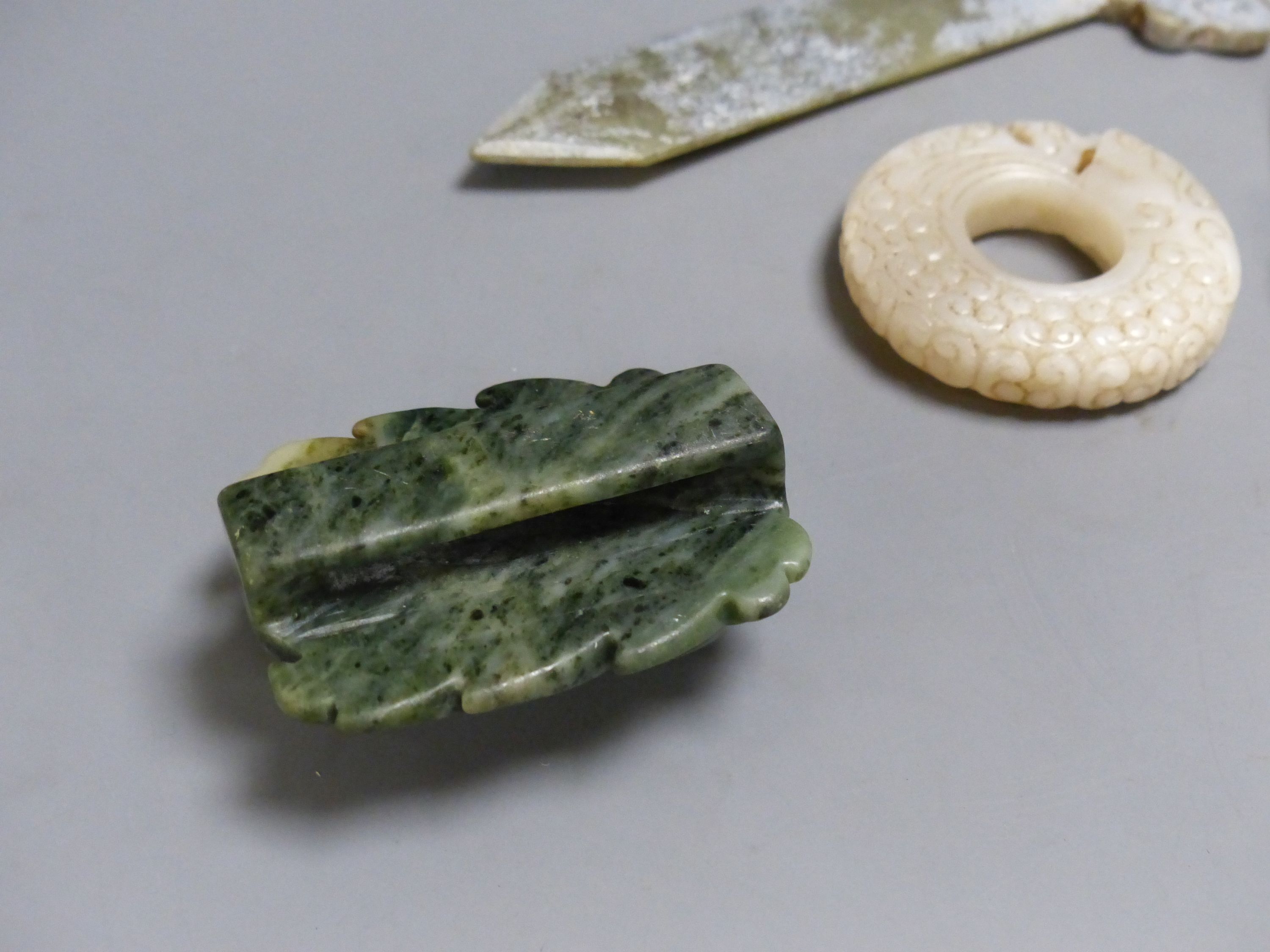 Seven Chinese jade or hardstone carvings, largest 15.5 cm